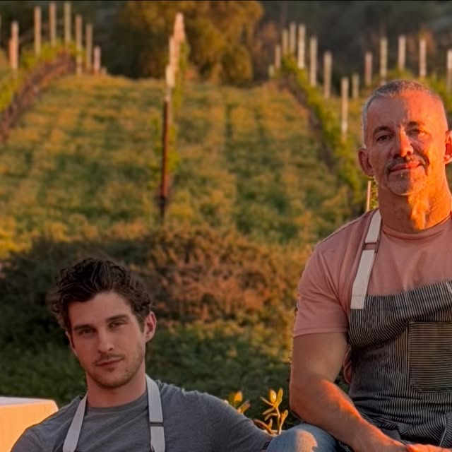 Dean and Pablo at the table in the vineyard