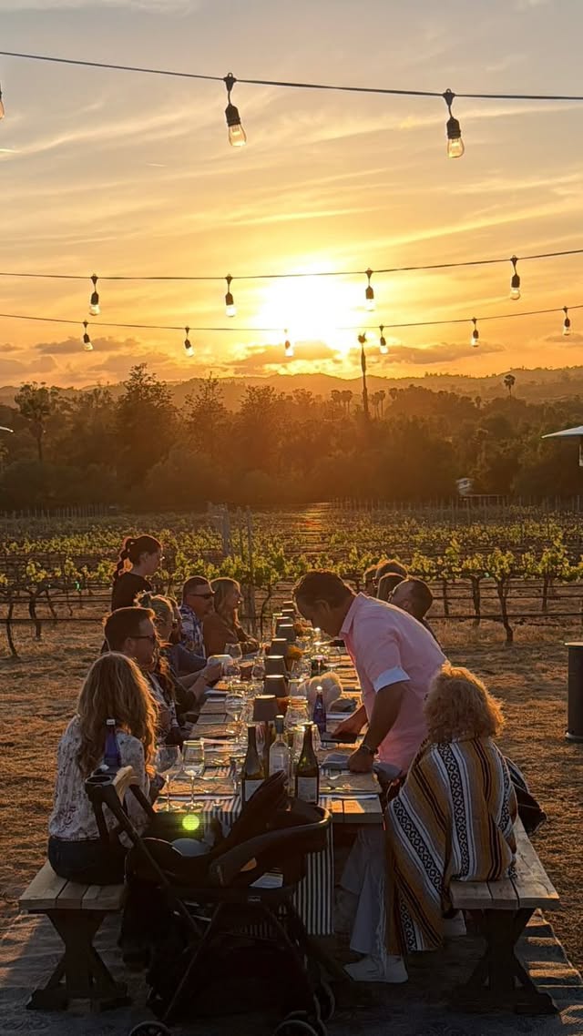 Sunset dinner at a long communal table in the vineyard